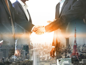 graphical representation of 2 businessmen shaking hands