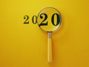 a magnifying glass over the number 2020