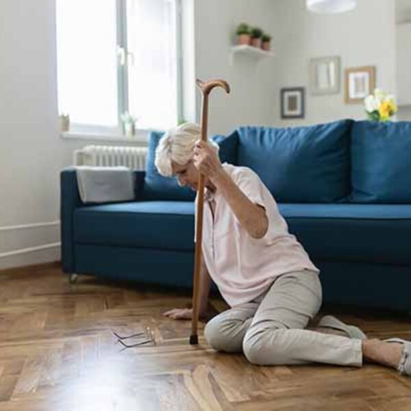 Senior Woman Suffering From Faint Lying on Floor After Falling Down at Home. Elderly Woman Fell on the Floor