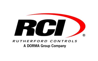 The image features the logo of Rutherford Controls, a part of DORMA Group. The logo prominently displays the letters 'RCI' in bold black font with a red swoosh above it, followed by 'Rutherford Controls' and 'A DORMA Group Company' in smaller text underneath.